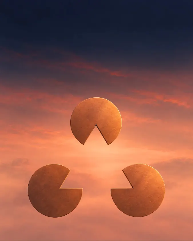 Three copper discs, each with a wedge cut away, arranged so a triangle seems to float between them